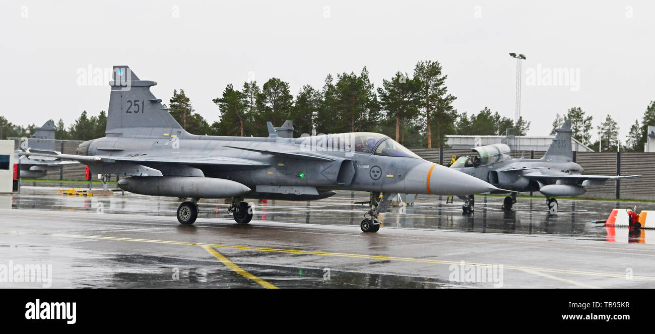 A Swedish Air Force JAS 39 Gripen taxies prior to flight operations during Arctic Challenge Exercise 2019 at Kallax Air Base, Luleå, Sweden, May 28, 2019. ACE 19 is a Nordic aviation exercise that provides realistic, scenario-based training to prepare forces for enemy defensive systems. U.S. forces are engaged, postured and ready to deter and defend in an increasingly complex security environment. (U.S. Navy Photo by Chief Mass Communication Specialist John M. Hageman) Stock Photo