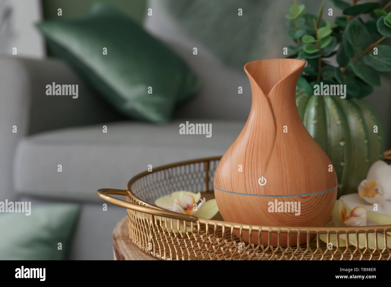 Aroma oil diffuser on table in room Stock Photo - Alamy
