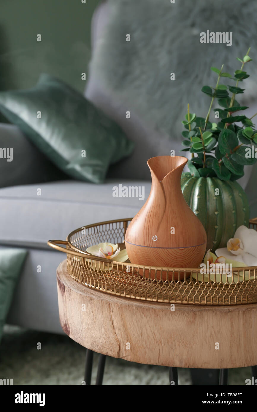 Aroma oil diffuser on table in room Stock Photo - Alamy