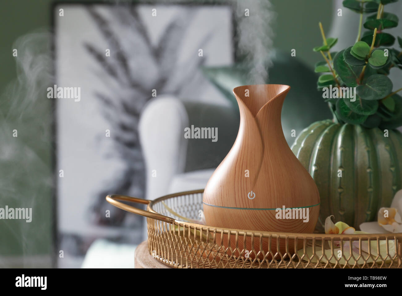 Aroma oil diffuser on table in room Stock Photo - Alamy