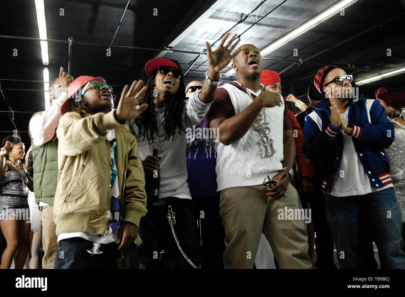 (L-R) Lil Chuckee, Rap Superstar Lil Wayne, Mack Maine and guest on the ...