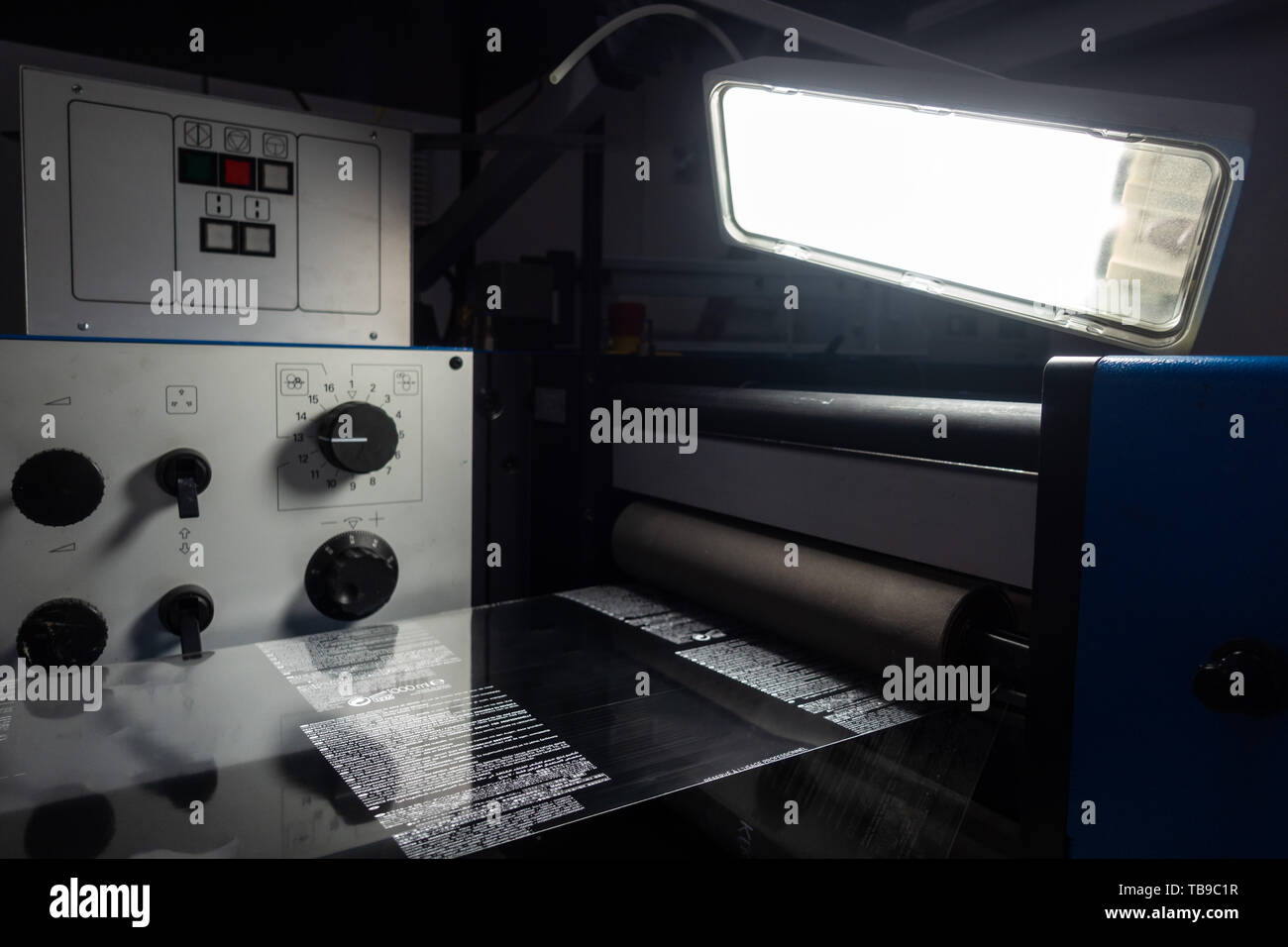 Industrial Label Printing Equipment Closeup Web Inspection Light High Contrast Plastic Stock Photo