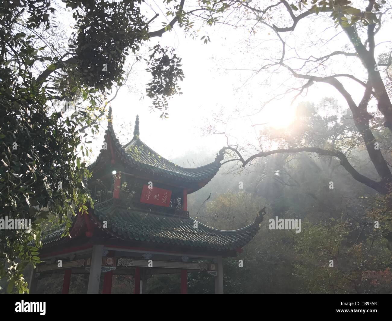 In December 2016, in the winter of Yuelu Mountain, the sun shines on the Iate Pavilion Stock Photo