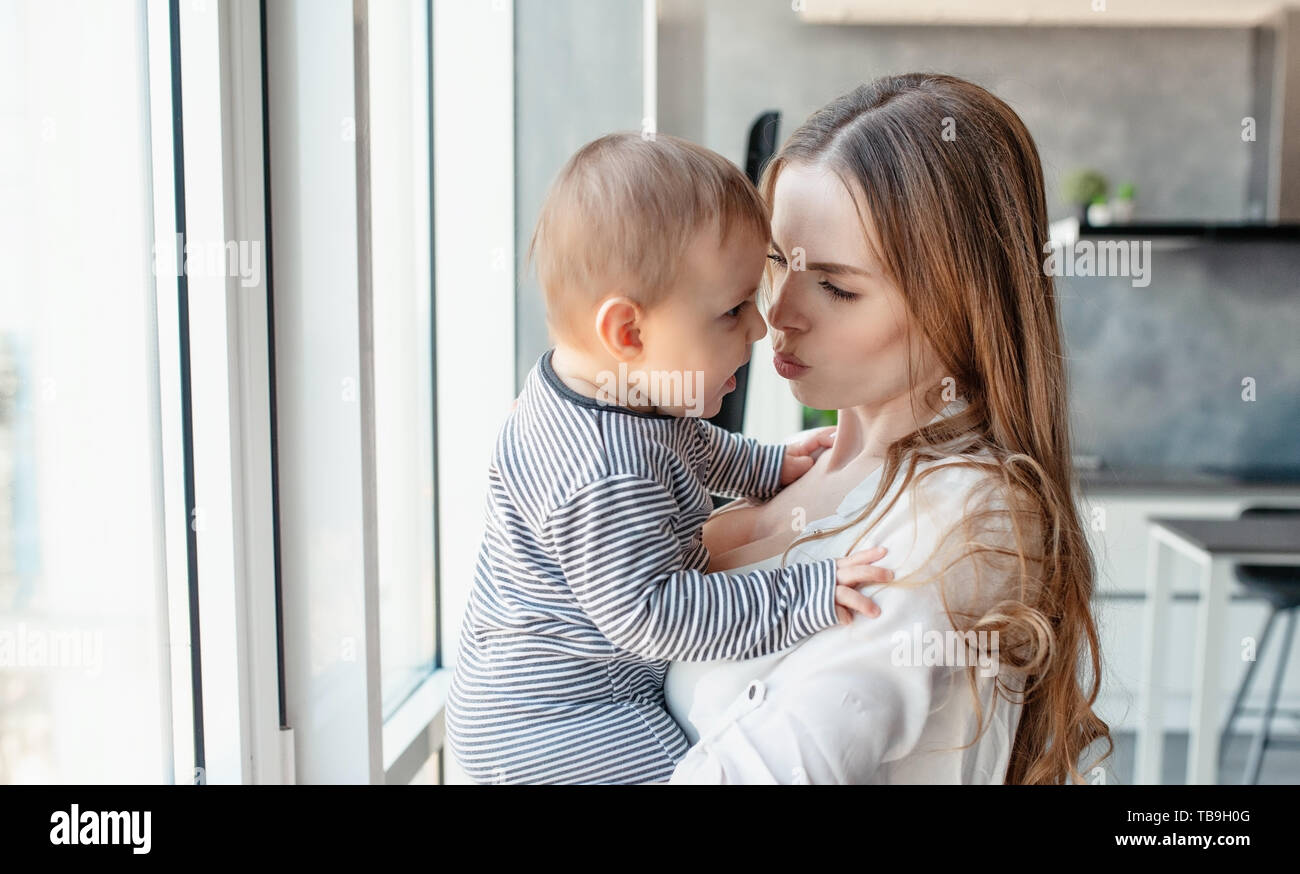 Little child smiling and happy with mom Stock Photo