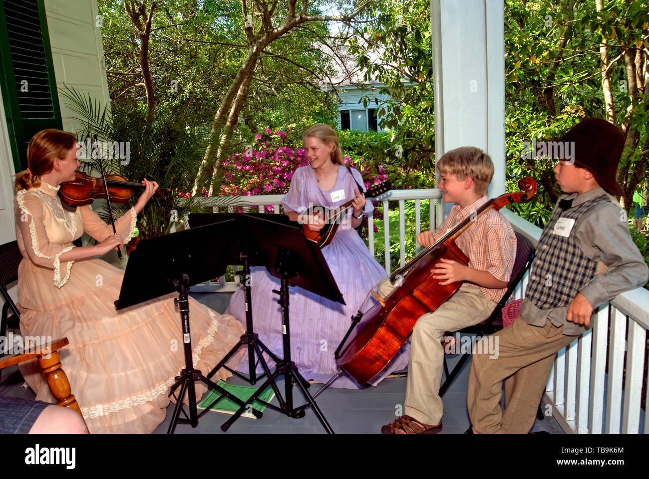 Children perform music on the porch of Twelve Gables during the annual Spring Pilgrimage in Columbus, Mississippi, April 16, 2010. Stock Photo