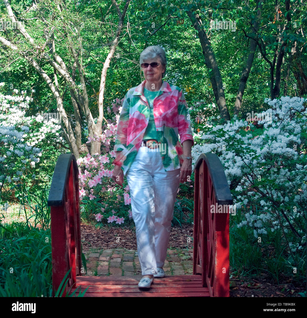 Martha Mims strolls through the gardens of the Amzi Love Home in Columbus, Mississippi, April 17, 2010. Stock Photo