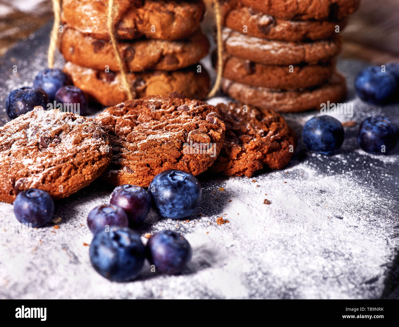 Chocolate chip cookies tied with string. Serving food on slate Stock Photo