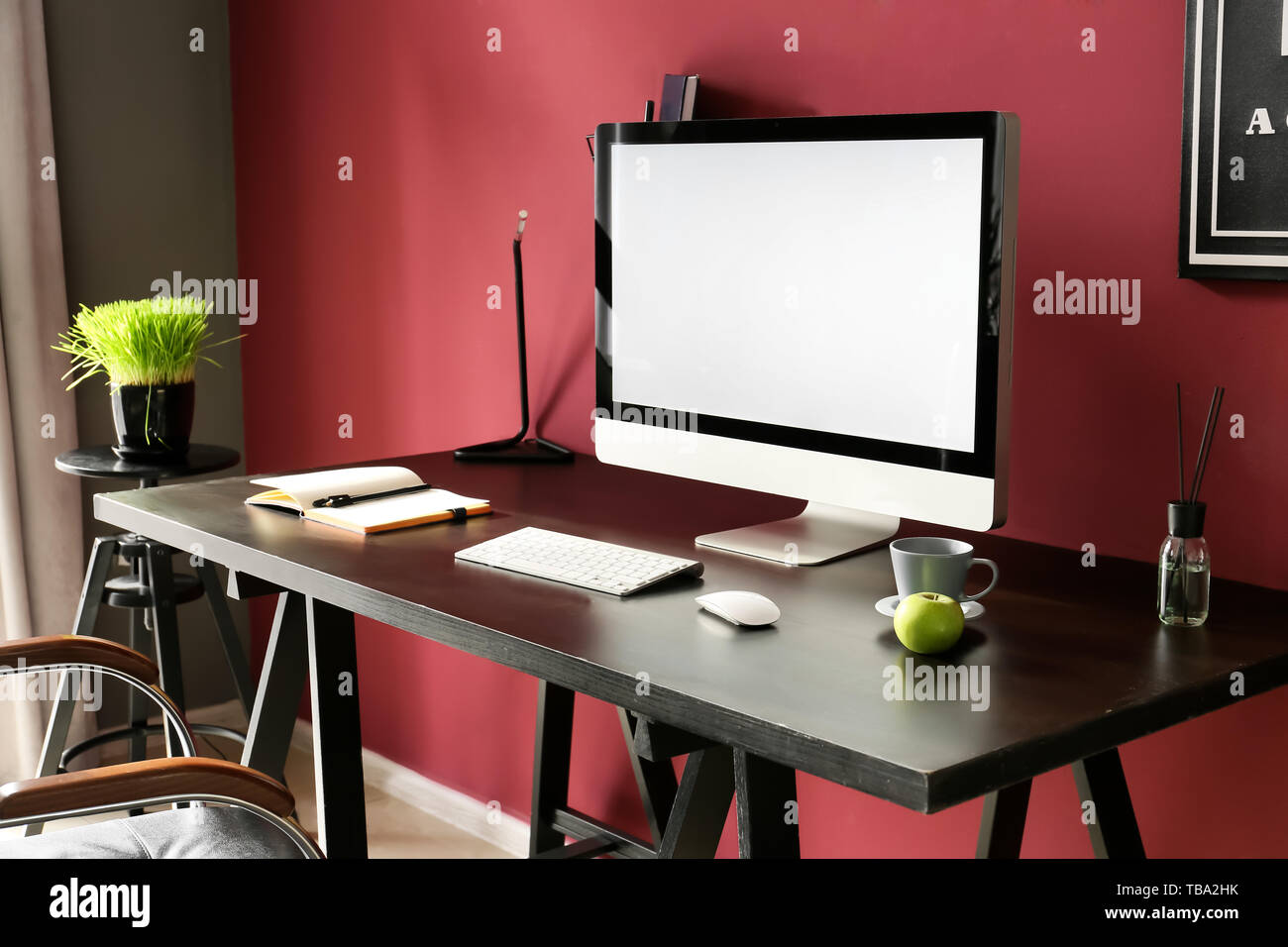 Stylish workplace with computer in modern room Stock Photo - Alamy