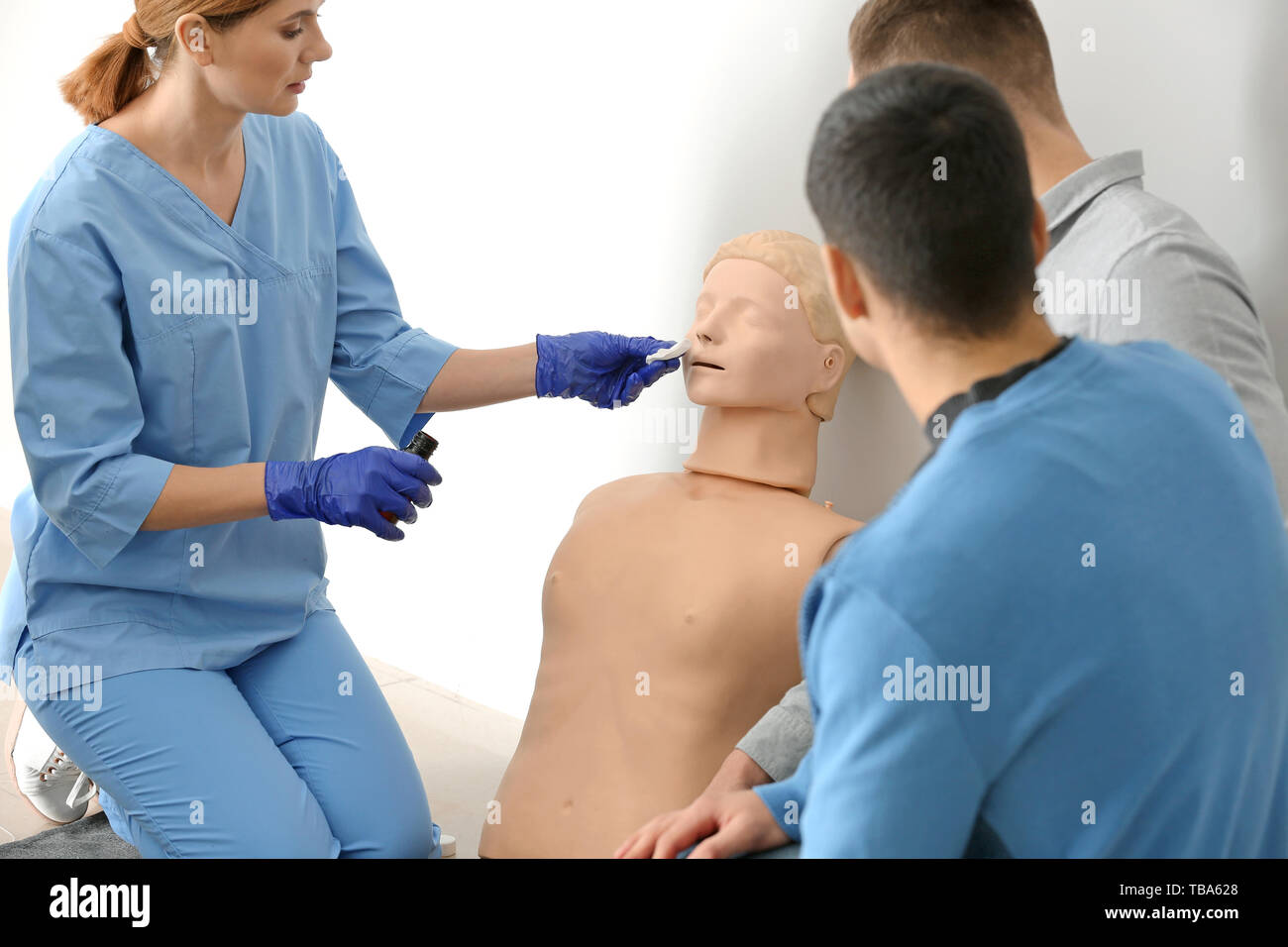 Group of people with instructor at first aid training course Stock Photo