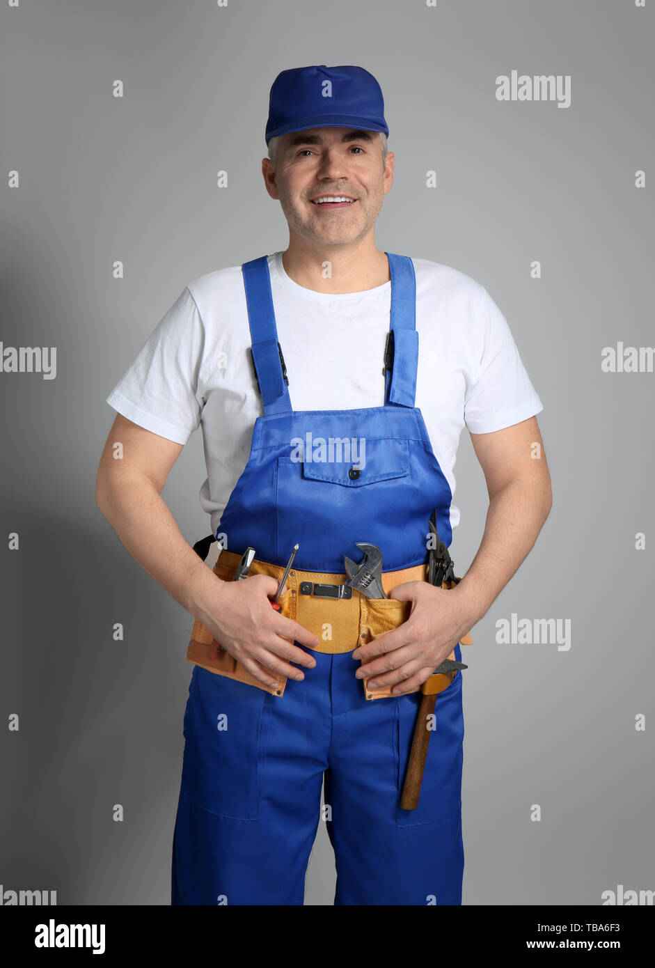 Mature repairman in uniform hi-res stock photography and images - Alamy