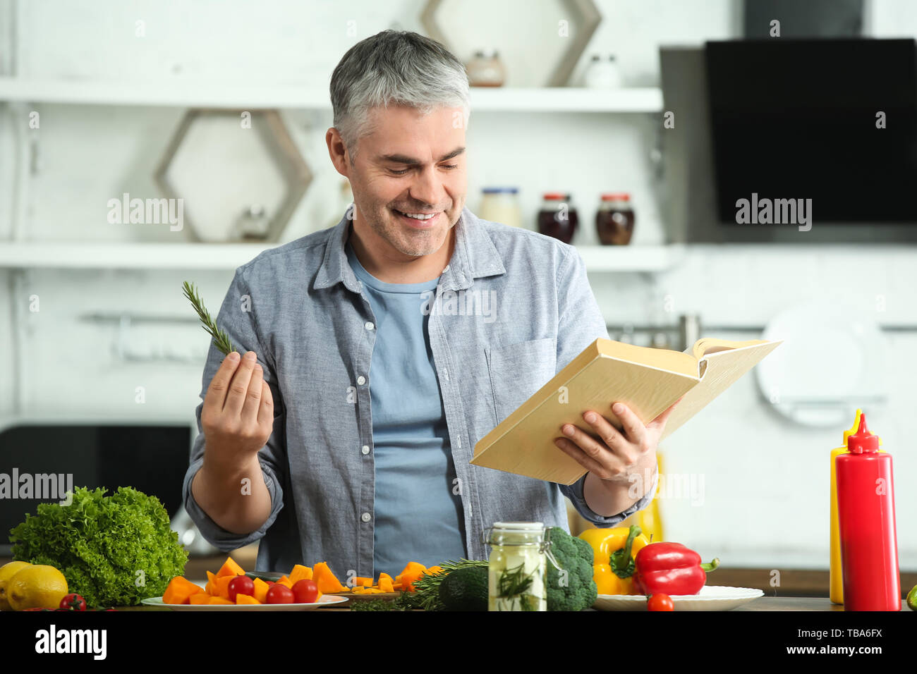 Mature man recipe book hi-res stock photography and images - Alamy