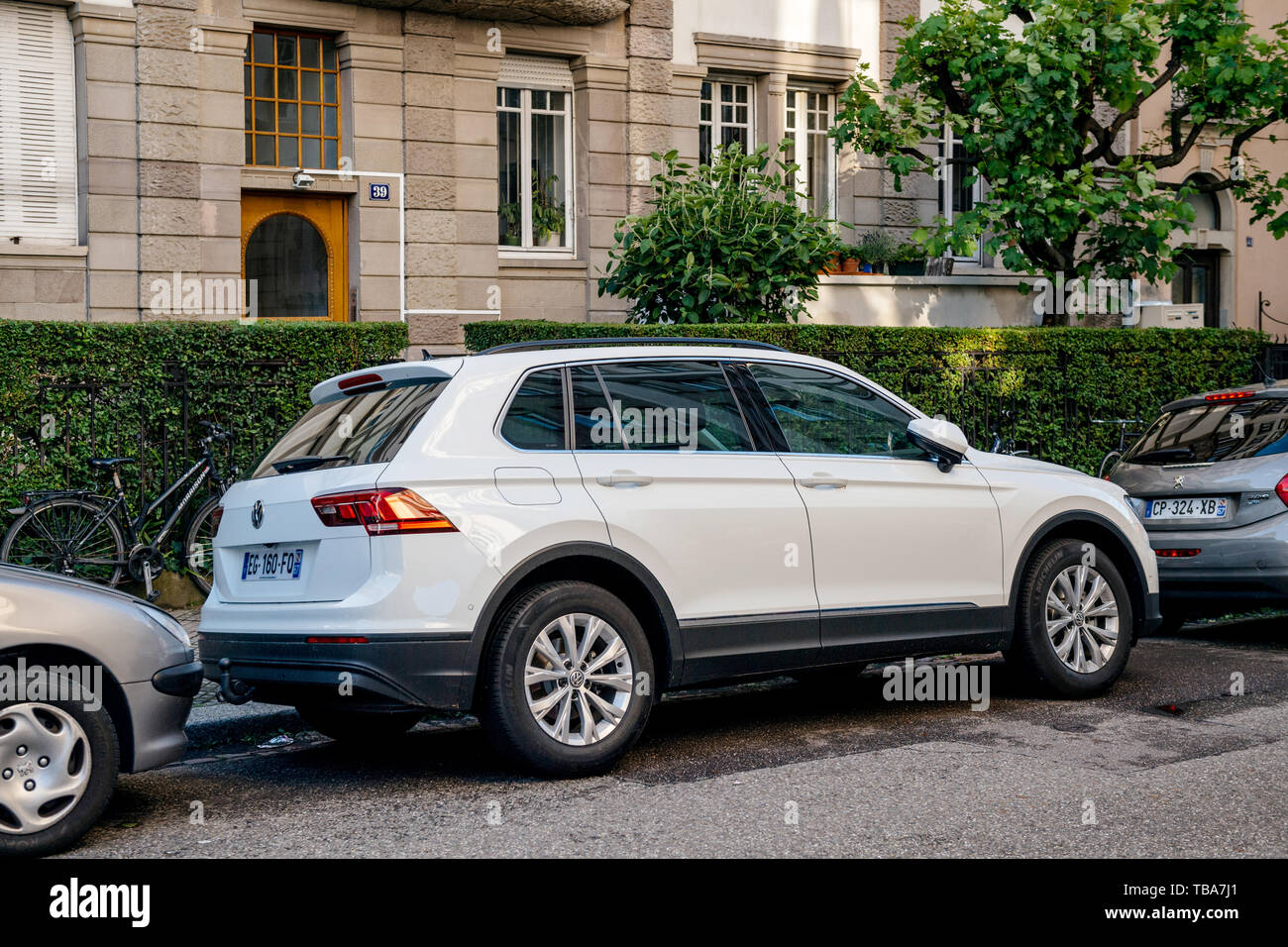 Strasbourg, France - May 19, 2017: Side view of white Volkswagen SUV parked on French street in city center  Stock Photo