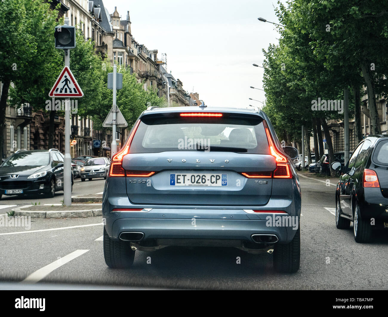 Strasbourg, France - May 2, 2018: Rear view of light blue Volvo XC60 D5 SUV driving in central French city Stock Photo