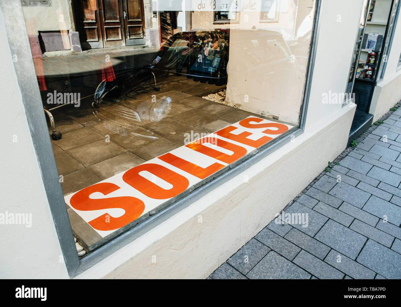 Strasbourg, France - Jul 22, 2017: View of Soldes Sales sing in in the  fashion store glass showcase with BMW mini car parked in the street Stock  Photo - Alamy