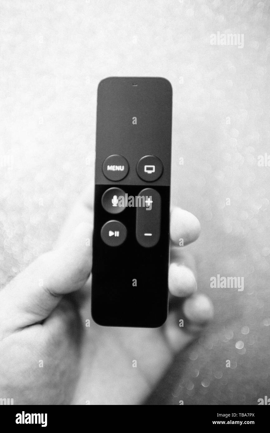 Paris France 25 Mar 2019 Defocused View Of Man Hand Holding Modern Apple Tv 4k Player Remote Control With Siri Assistant Browsing Apple Tv Plus Subscription Film Series Documentaries Stock Photo Alamy