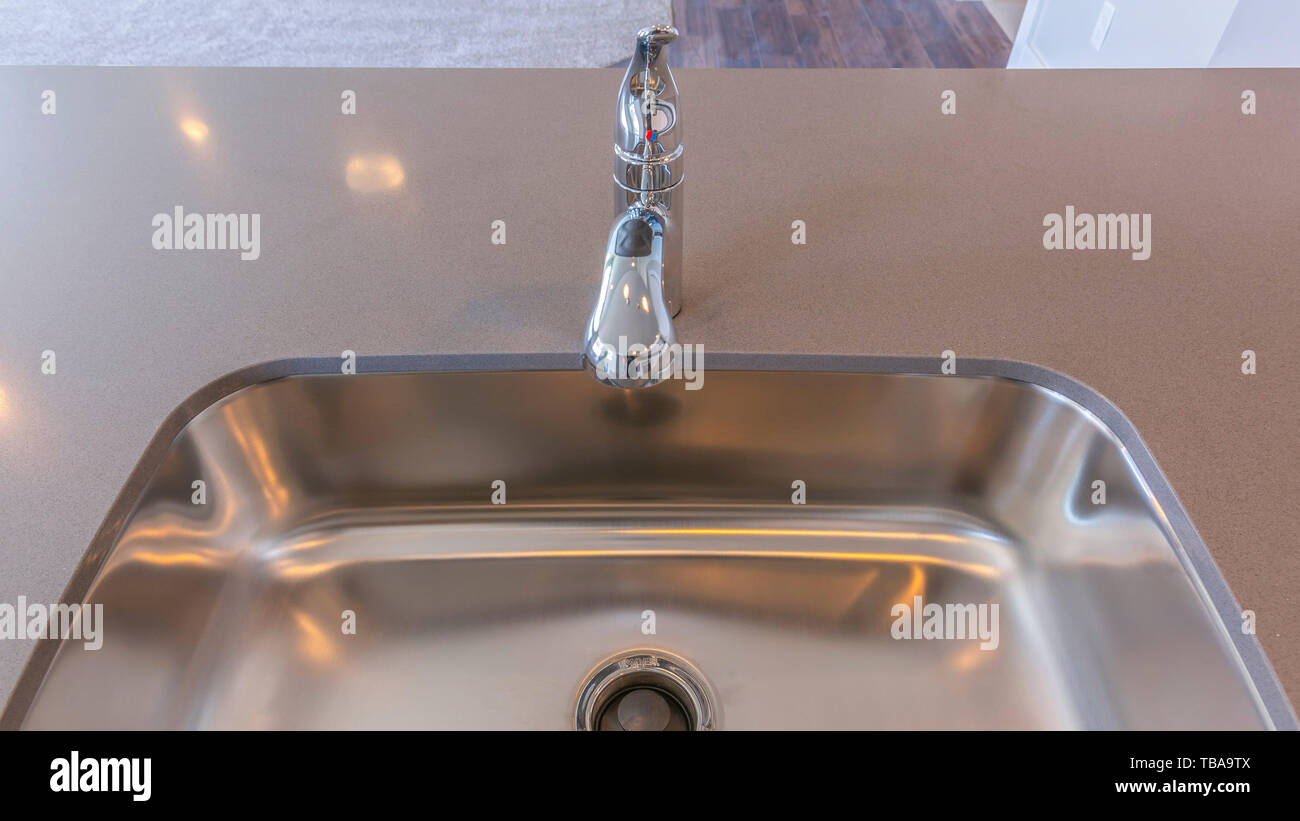 Frame Panorama Shiny Stainless Steel Sink And Faucet On The