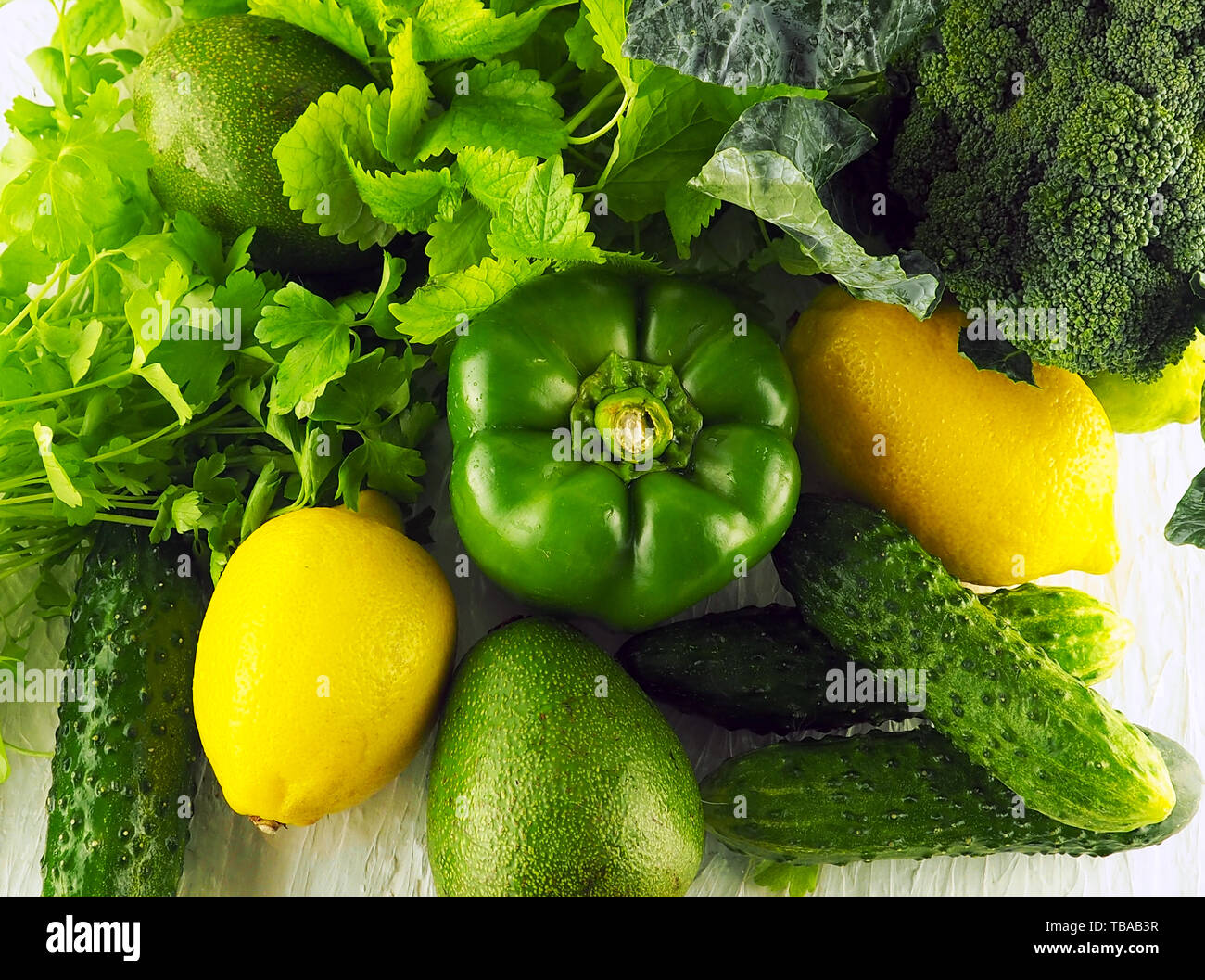 collection of green vegetables and fruits on white background Stock