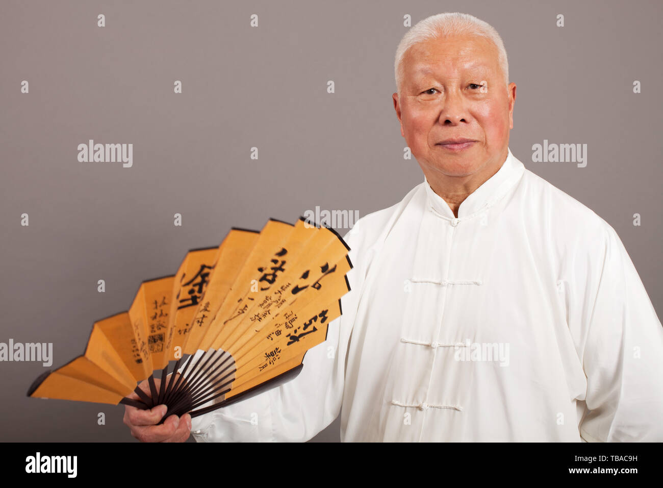 An old man in a traditional costume. Stock Photo