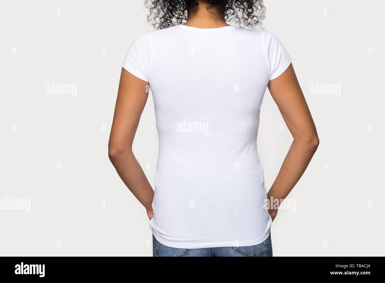 Cropped image african female wearing white t-shirt rear view Stock Photo