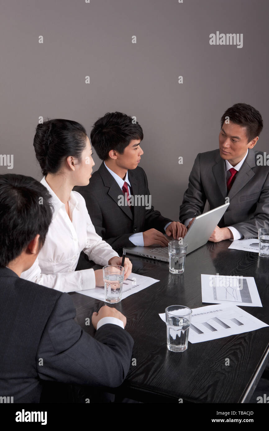 A team is meeting in a conference room. Stock Photo