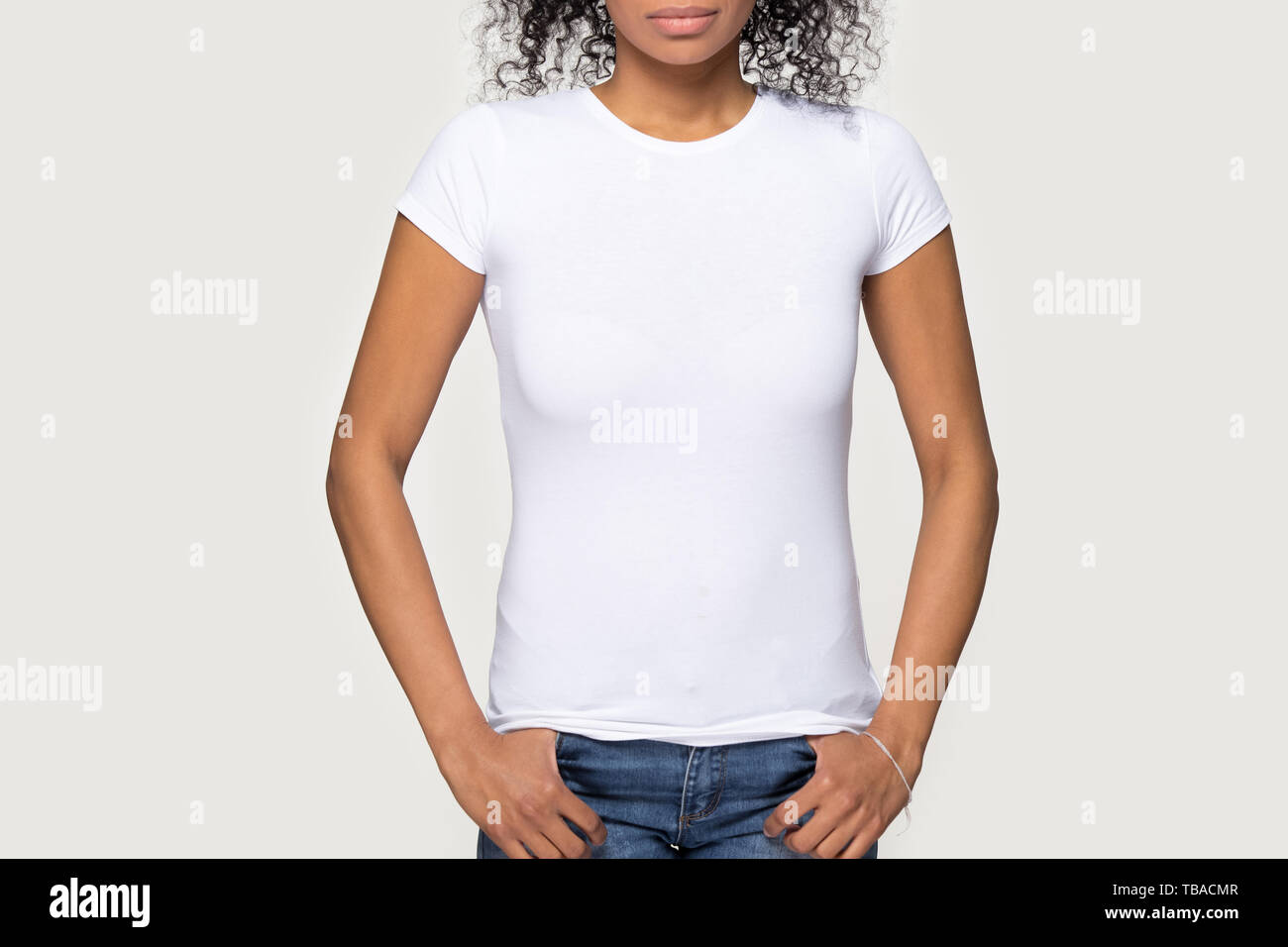 Cropped image african female wearing white t-shirt and jeans Stock Photo
