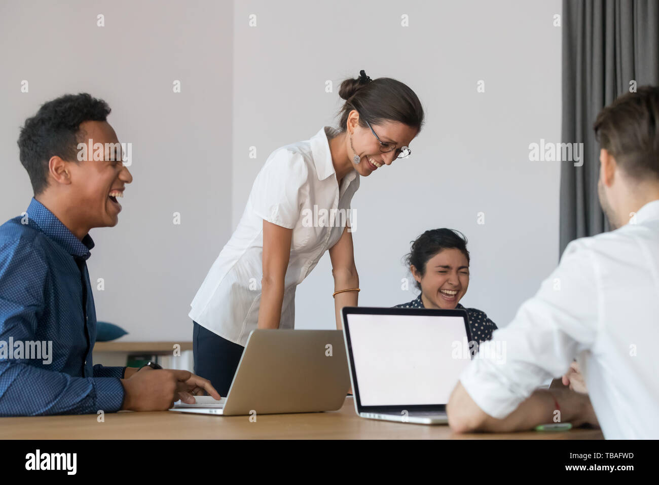 Happy multiethnic employees laugh meeting at office briefing Stock ...
