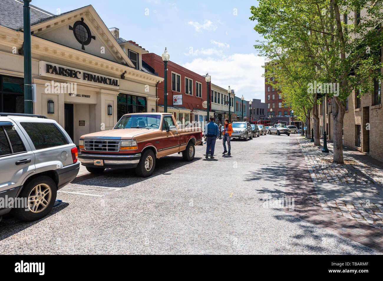 Asheville, USA - April 19, 2018: Wall street shopping mall with people walking by stores shops in North Carolina Stock Photo