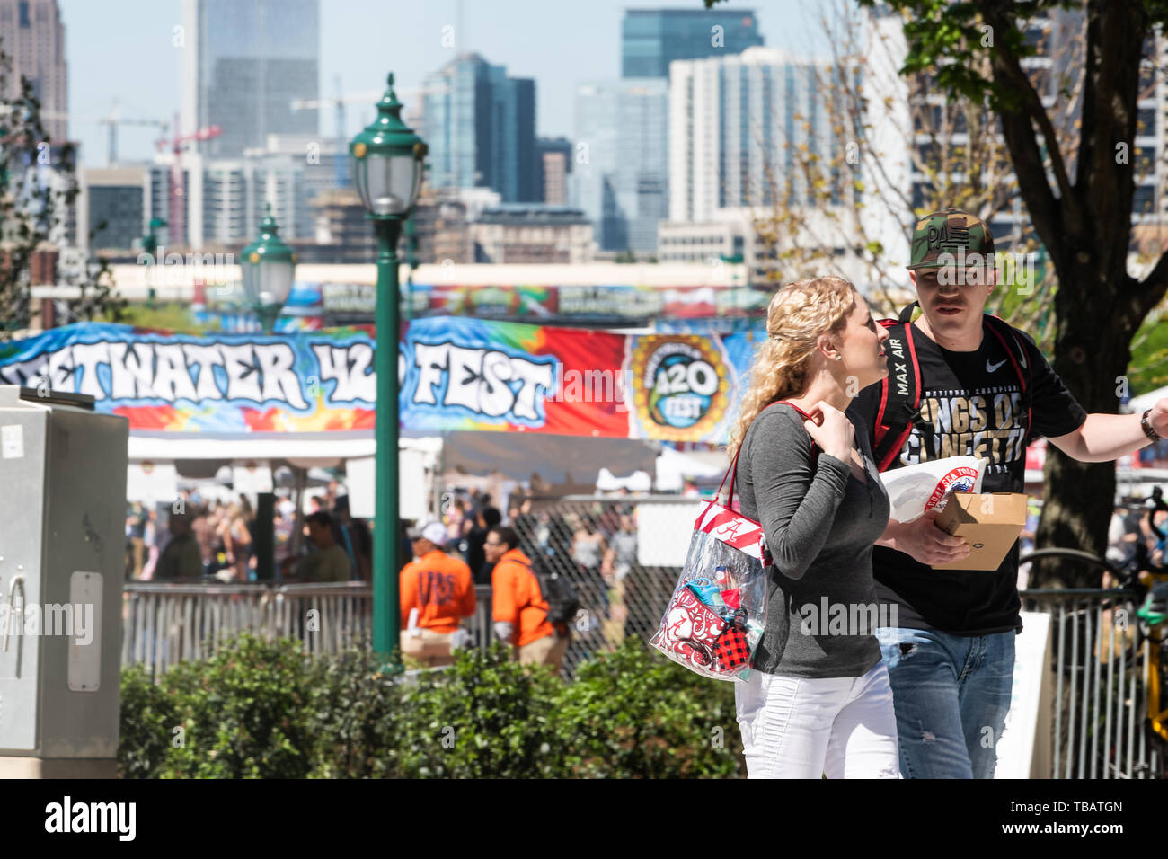 Atlanta, USA - April 20, 2018: Road during day in downtown capital Georgia city with people walking on street by sweetware 420 marijuana festival Stock Photo
