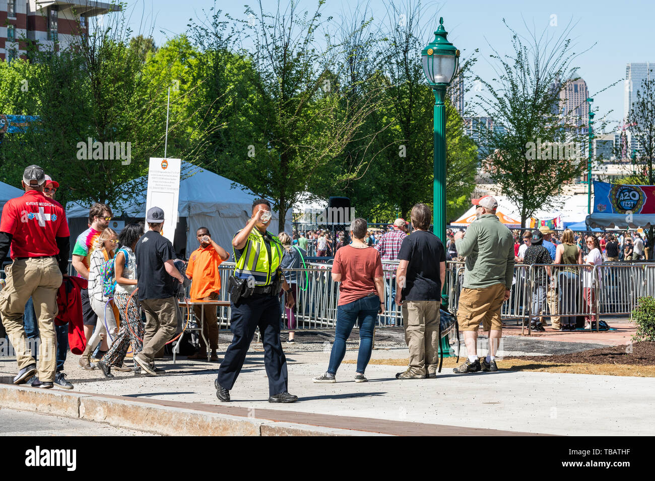 Atlanta, USA - April 20, 2018: Road during day in downtown capital Georgia city with many people walking on street by sweetware 420 marijuana festival Stock Photo