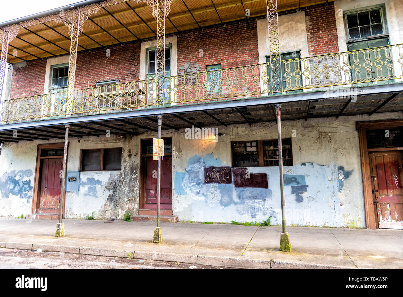 New Orleans, USA - April 22, 2018: Old Dauphine street district in Louisiana city town with antique run down apartment house Stock Photo