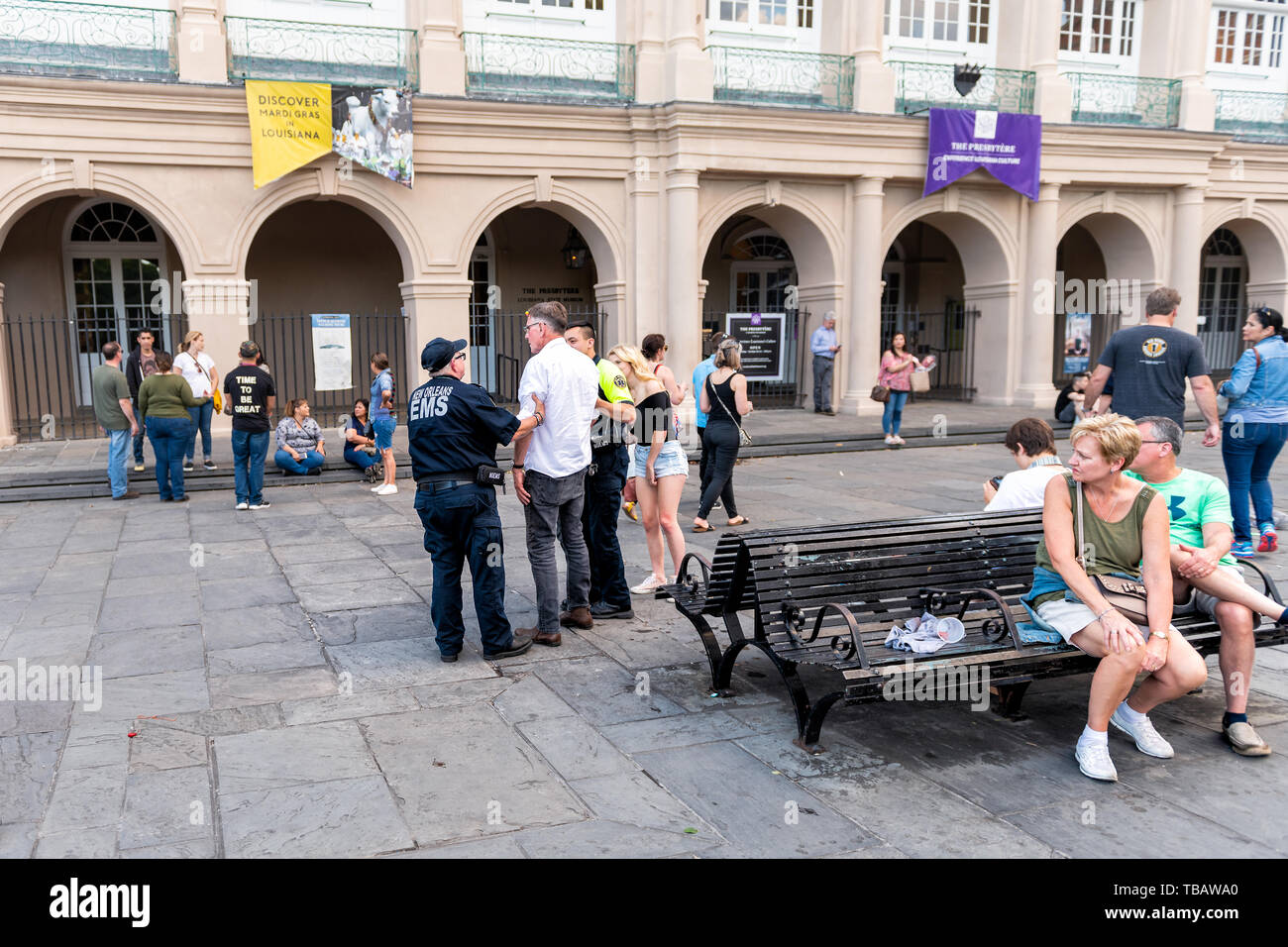 New Orleans, USA - April 22, 2018: Jackson Square in Louisiana famous town during day with EMS security police guard officer arresting man Stock Photo