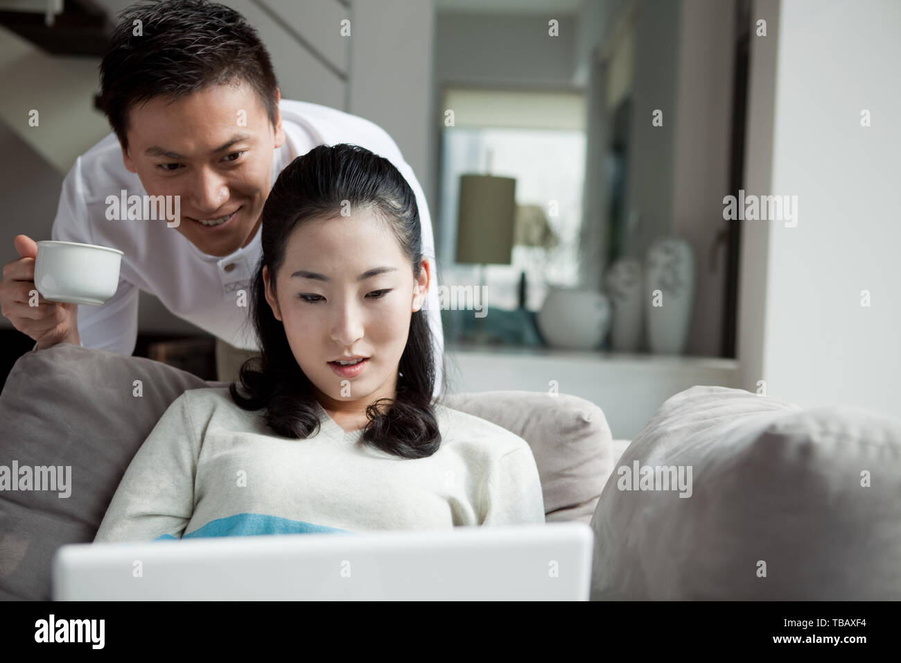 A couple using a laptop Stock Photo