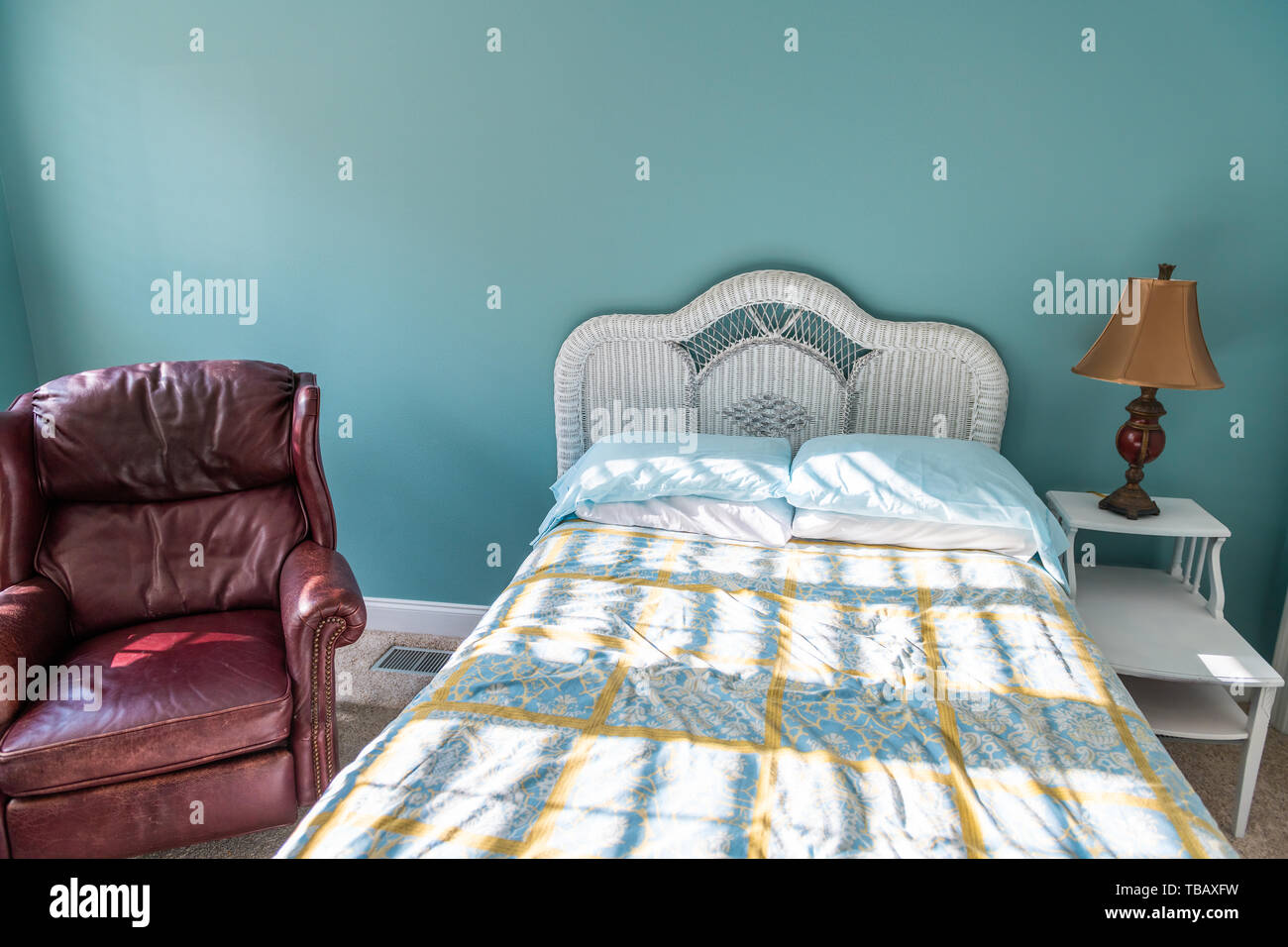 New clean bed comforter with wicker rattan headboard table vintage