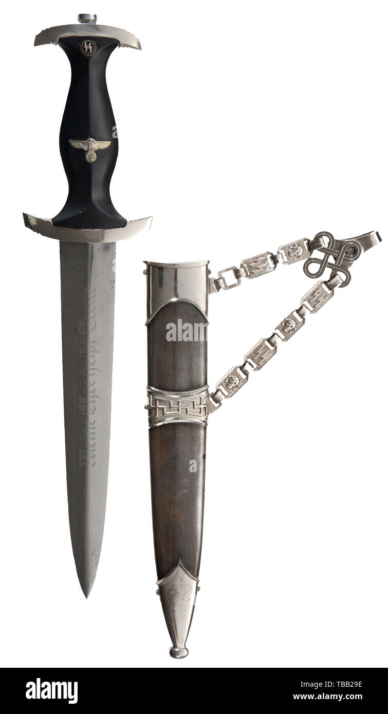 THE JOHN PEPERA COLLECTION, SS-Standartenführer Helmuth Schön - a M 1936 SS presented service dagger, with chain hanger, Polished blade (greying) with etched motto. Reverse etched with 'In alter Kamradschaft 2. X. 1937 Dein Helmuth Schön SS Standartenführer' (tr. 'To old comradeship, October 2, 1937 yours Helmuth Schön SS-Colonel'). Nickel-plated hilt fittings. Restored black ebony wooden grip with inset nickel silver eagle and enamelled SS-emblem. Service worn restored black burnished steel scabbard with nickel-plated fittings. Nickel-plated type I chain hanger with stampe, Editorial-Use-Only Stock Photo