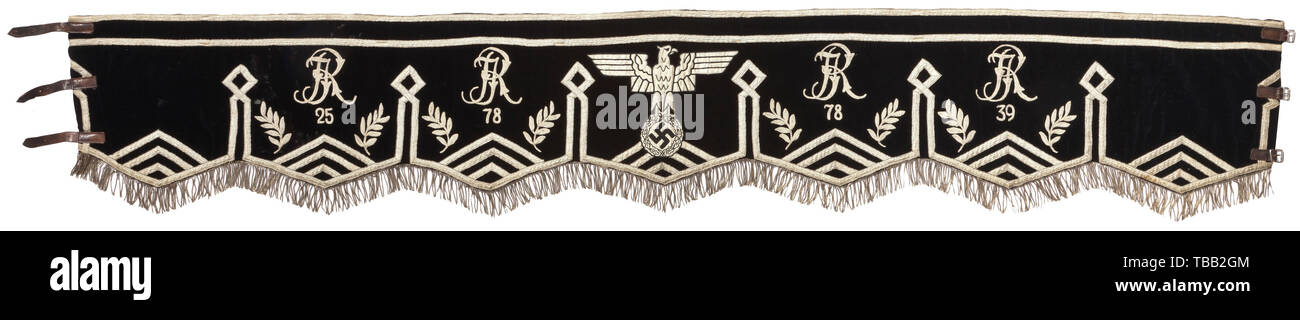 A large kettledrum cloth Black velvet with continuous silver fringes, light-coloured shiny ribbons, laurel branches, black and white national eagle with silver interweaves flanked by embroidered ciphers of the Infantry Regiments 25, 78, and 39. Black cotton lining, six leather loops at back, three leather straps with iron buckles. Signs of age and usage. Length circa 200 cm. Rare. historic, historical, infantry, military, armed forces, militaria, object, objects, stills, clipping, clippings, cut out, cut-out, cut-outs, 20th century, Additional-Rights-Clearance-Info-Not-Available Stock Photo