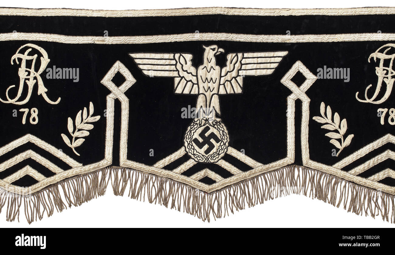 A large kettledrum cloth Black velvet with continuous silver fringes, light-coloured shiny ribbons, laurel branches, black and white national eagle with silver interweaves flanked by embroidered ciphers of the Infantry Regiments 25, 78, and 39. Black cotton lining, six leather loops at back, three leather straps with iron buckles. Signs of age and usage. Length circa 200 cm. Rare. historic, historical, infantry, military, armed forces, militaria, object, objects, stills, clipping, clippings, cut out, cut-out, cut-outs, 20th century, Additional-Rights-Clearance-Info-Not-Available Stock Photo