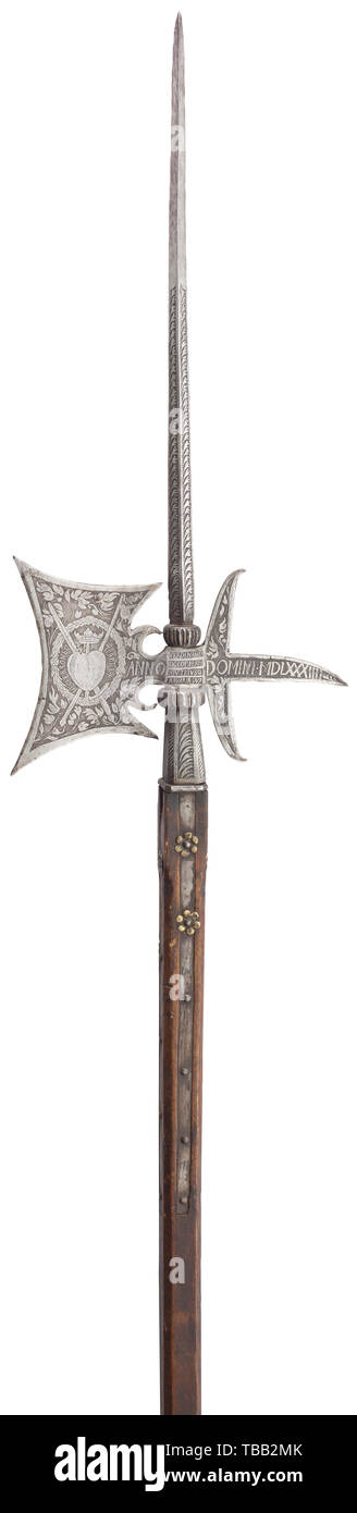 An etched halberd of the palace guard of Ferdinand of Bavaria, dated 1584 Robust thrusting spike of quadrangular section, at the base a compressed ball with fullered decoration. Rectangular blade, the fluke on the reverse with two long lateral lugs. Square socket with four long side straps and reinforced by a ring. One face of the blade etched with the Bavarian coat of arms and date 'ANNO MDLXXXIIII'. The reverse with crowned heart in a wreath and surrounding motto 'NEC FERRO NEC (IG)NE TERRITUR' (two characters illegible due to impact marks). Bo, Additional-Rights-Clearance-Info-Not-Available Stock Photo