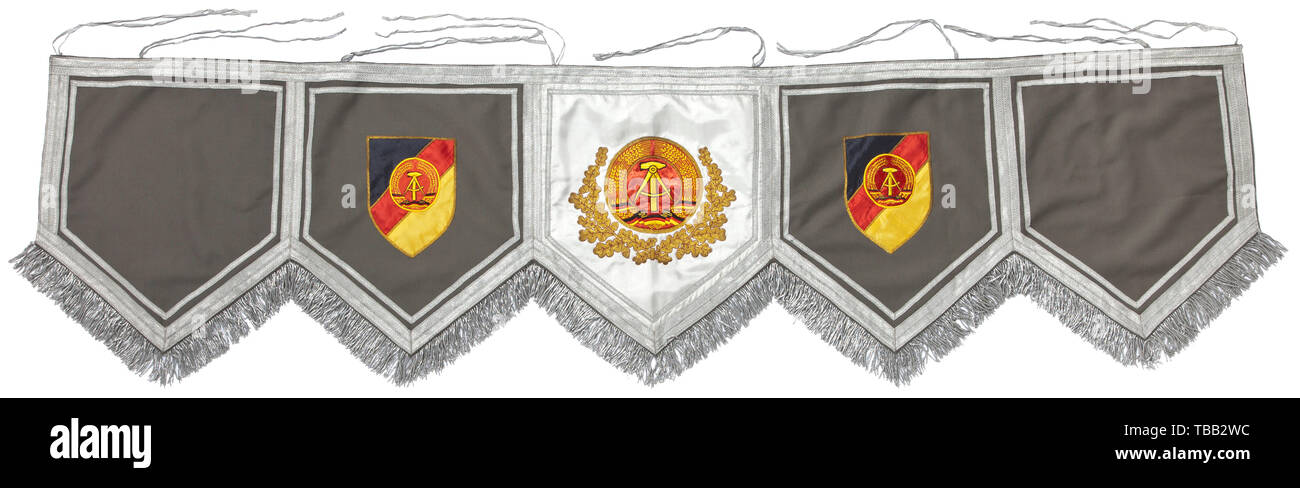 A kettledrum banner of the marching bands of the National People's Army of the GDR. Field-grey base with five sections, a continuous silver border with fringes. Total length 193 cm. With fastening cords. Very rare. historic, historical, 20th century, GDR, East Germany, Eastern Germany, East-German, East German, object, objects, stills, clipping, cut out, cut-out, cut-outs, Additional-Rights-Clearance-Info-Not-Available Stock Photo