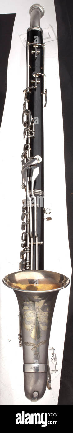 An alto clarinet from a Luftwaffe music corps, with case The body made from hardwood, the key mechanism made from silver-plated nickel silver. The mouthpiece with padded neckband. The bell with maker's sign and engraved Luftwaffe eagle as well as the year 1939. Total length approximately 83 cm. Dimensions of the case 46 x 23 x 12.5 cm. Not checked for completeness. Alto clarinet in E flat from the G.H. Hüller company, Schöneck, construction number 37846, playable. The Luftwaffe Musikinspizient Professor Hans Felix Husadel (1897 - 1964) equipped the newly founded music corps, Editorial-Use-Only Stock Photo