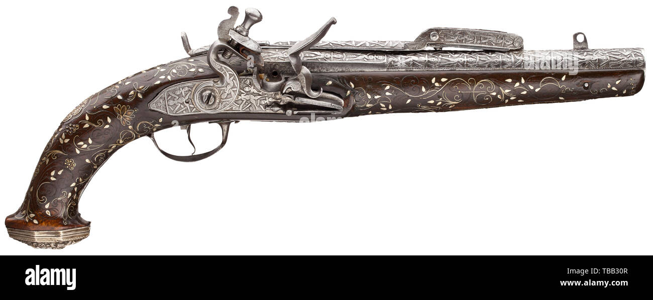 A flintlock pistol with spring-loaded bayonet, colonial work, 19th century Two-stage smooth-bore barrel, octagonal then round, in 15 mm calibre, on top a spring-loaded bayonet. The mechanism of the flintlock is slightly fatigued. Barrel, bayonet and lock completely chiselled with anthropomorphic figures. Dark full stock with floral nickel silver inlays, iron furniture and silver grip caps in fine relief. Length 37.5 cm. historic, historical, civil handgun, civil handguns, handheld, gun, guns, firearm, fire arm, firearms, fire arms, weapons, arms,, Additional-Rights-Clearance-Info-Not-Available Stock Photo