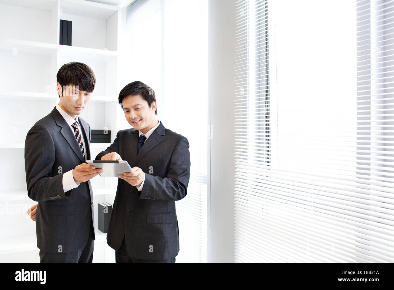 Communication between two business people at work Stock Photo