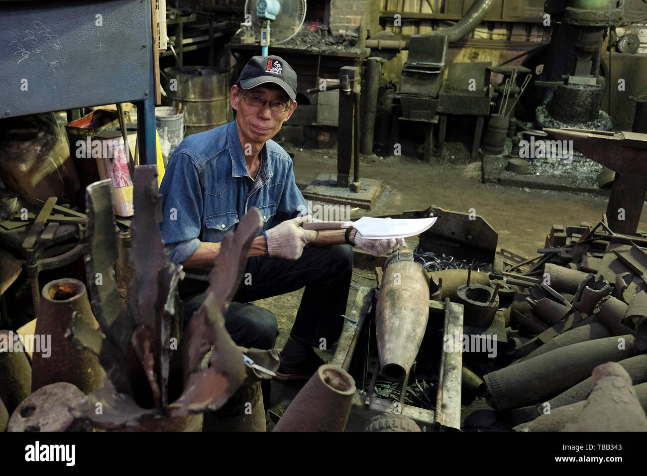 https://c8.alamy.com/comp/TBB343/taiwanese-blacksmith-wu-tseng-tong-known-as-maestro-wu-crafts-a-knife-from-recovered-artillery-shells-in-kinmen-county-or-island-few-miles-from-mainland-china-taiwan-back-in-the-1950s-the-islands-were-heavily-shelled-during-the-two-taiwan-strait-crisesmilitary-clashes-between-the-prc-and-roc-TBB343.jpg