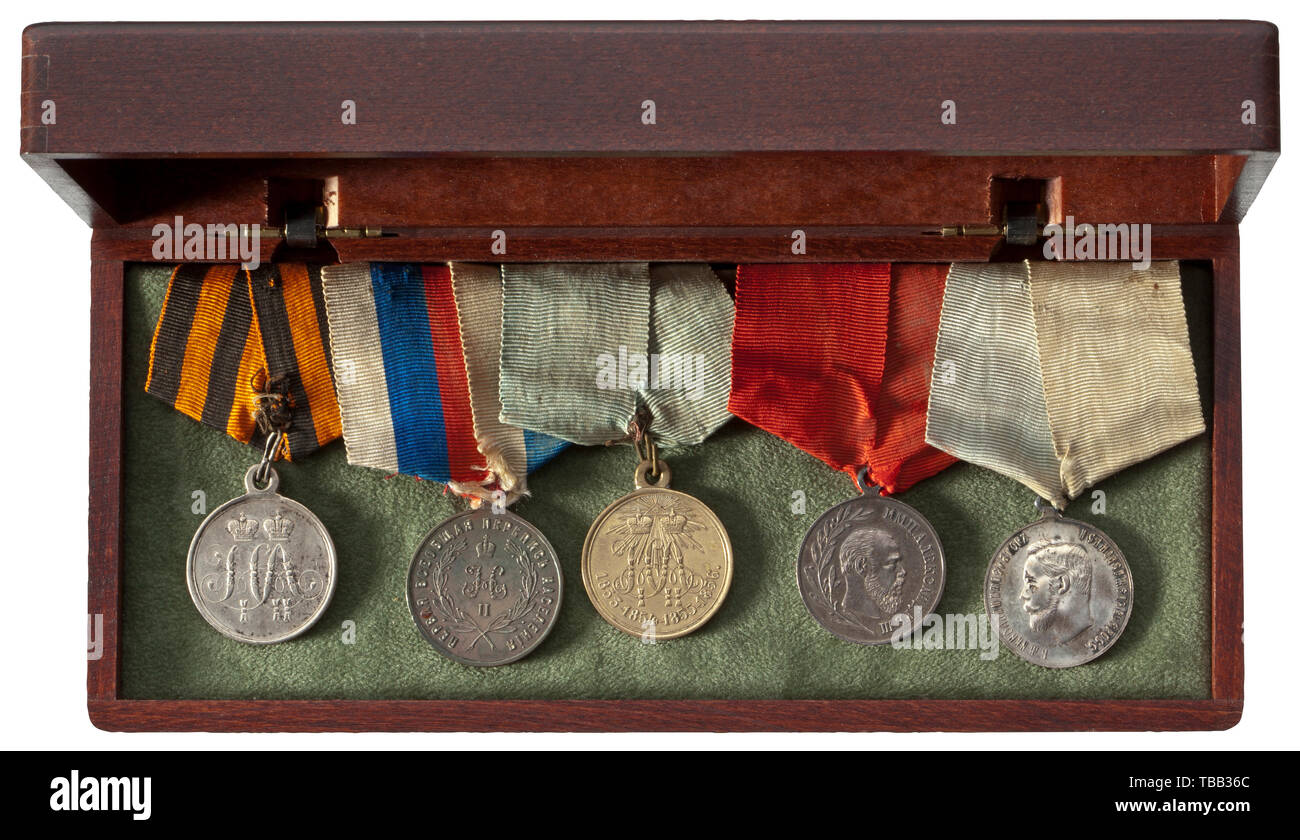 Five medals from aristocratic possession A Medal for the Defense of Sevastopol, silver medal founded in 1856 for the Crimean War, a Medal for the General Census 1897 (silver), a Crimean War (1853 - 1856) Medal in Bronze, a Medal on the Death of Tsar Alexander II (silver) and a Coronation Medal of Nicholas II, silver. All are on the original pentagonal ribbons for wear. historic, historical, medal, decoration, medals, decorations, badge of honour, badge of honor, badges of honour, badges of honor, 19th century, Additional-Rights-Clearance-Info-Not-Available Stock Photo