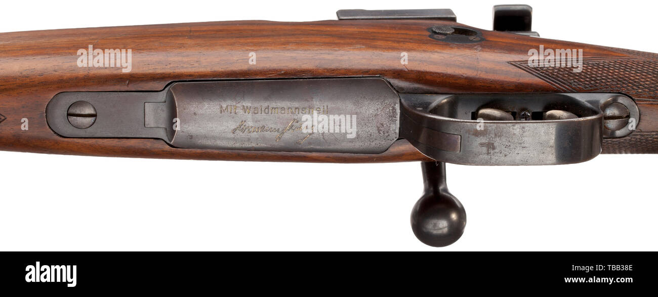 A repeating rifle Mauser Mod. 98, engraved 'Mit Waidmannsheil/Hermann Göring' Cal..243 Win, no. 114870. Manufactured circa 1933/34. Contemporary proof mark on action and lock. Barrel, action and lock with proof mark 1972, Federal Republic of Germany. Stock with chequering. Adjustable cheek-piece. German hair trigger. Additional safety above trigger on left-hand side. On left side of action inscribed 'Mauser-Werke A.G. Oberndorf A/N'. Mauser barrel on receiver head. Magazine plate cover engraved 'Mit Waidmannsheil', underneath facsimile signature , Additional-Rights-Clearance-Info-Not-Available Stock Photo