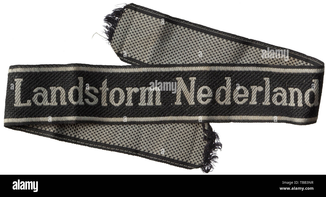 A cuff title 'Landstorm Nederland' BeVo-woven issue. Used condition. Length 42 cm. historic, historical, 20th century, 1930s, 1940s, Waffen-SS, armed division of the SS, armed service, armed services, NS, National Socialism, Nazism, Third Reich, German Reich, Germany, military, militaria, utensil, piece of equipment, utensils, object, objects, stills, clipping, clippings, cut out, cut-out, cut-outs, fascism, fascistic, National Socialist, Nazi, Nazi period, Editorial-Use-Only Stock Photo