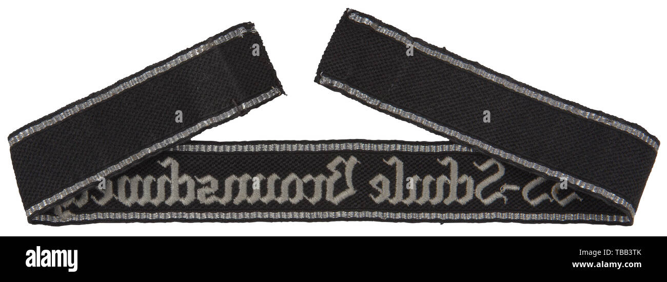 A cuff title 'SS-Schule Braunschweig' for enlisted men RZM-type, machine-embroidered, silver-grey thread inscription, top/bottom edges bordered with silver/aluminium flat wire threads. Cloth label, RZM St 531/36 SS. Length 44 cm. USA-Los historic, historical, 20th century, 1930s, 1940s, Waffen-SS, armed division of the SS, armed service, armed services, NS, National Socialism, Nazism, Third Reich, German Reich, Germany, military, militaria, utensil, piece of equipment, utensils, object, objects, stills, clipping, clippings, cut out, cut-out, cut-outs, fascism, fascistic, Na, Editorial-Use-Only Stock Photo