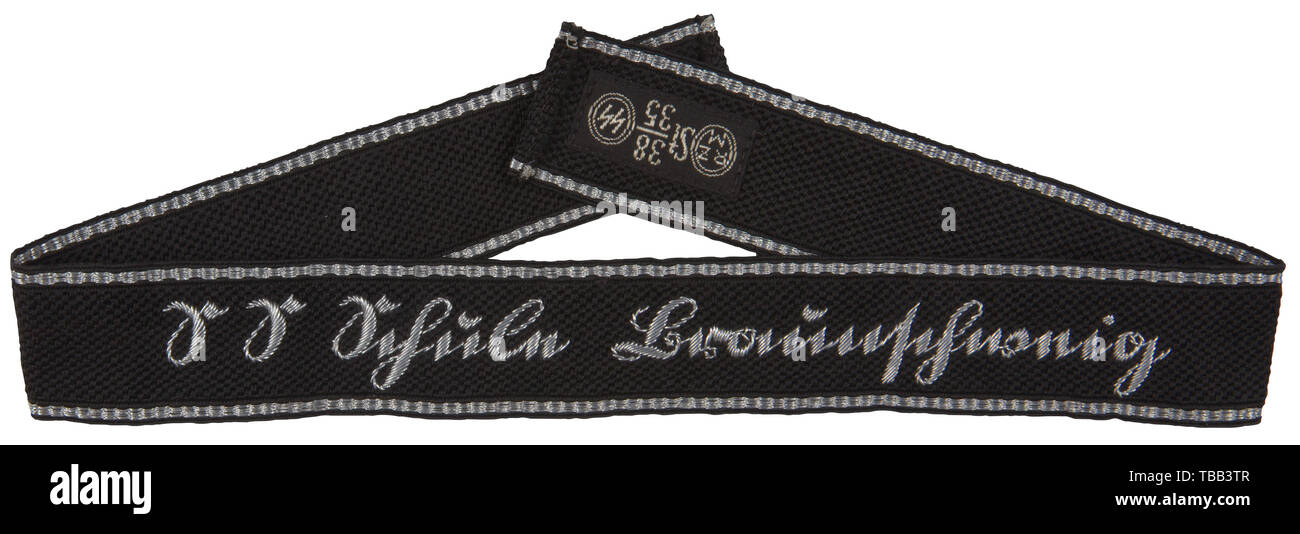 A cuff title 'SS-Schule Braunschweig' for officers RZM-type, hand-embroidered, silver wire thread title, Sütterlin script, top/bottom edges bordered with silver/aluminium flat wire threads. Finished ends, one cloth label, RZM St 38/35 SS. Length 48 cm. USA-Los historic, historical, 20th century, 1930s, 1940s, Waffen-SS, armed division of the SS, armed service, armed services, NS, National Socialism, Nazism, Third Reich, German Reich, Germany, military, militaria, utensil, piece of equipment, utensils, object, objects, stills, clipping, clippings, cut out, cut-out, cut-outs,, Editorial-Use-Only Stock Photo