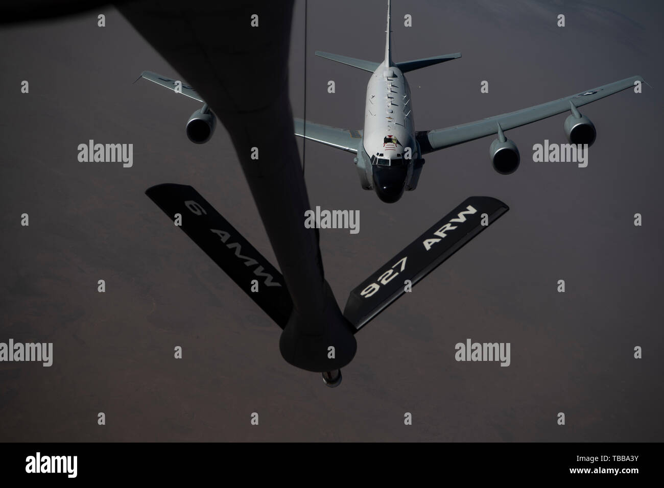 A U.S. Air Force RC-135 Rivet Joint receives fuel from a KC-135 Stratotanker during a mission within the U.S. Air Force Central Command Area of Responsibility May 26, 2019. The Rivet Joint supports theater and national level consumers with near real time on-screen intelligence collection, analysis and dissemination capabilities. (U.S. Air Force photo by Master Sgt. Russ Scalf) Stock Photo