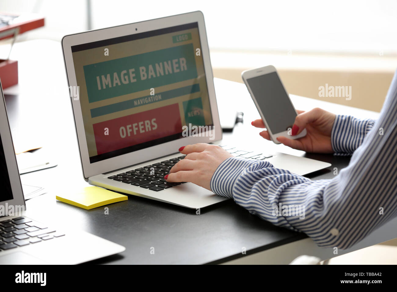 Female IT designer working in office Stock Photo
