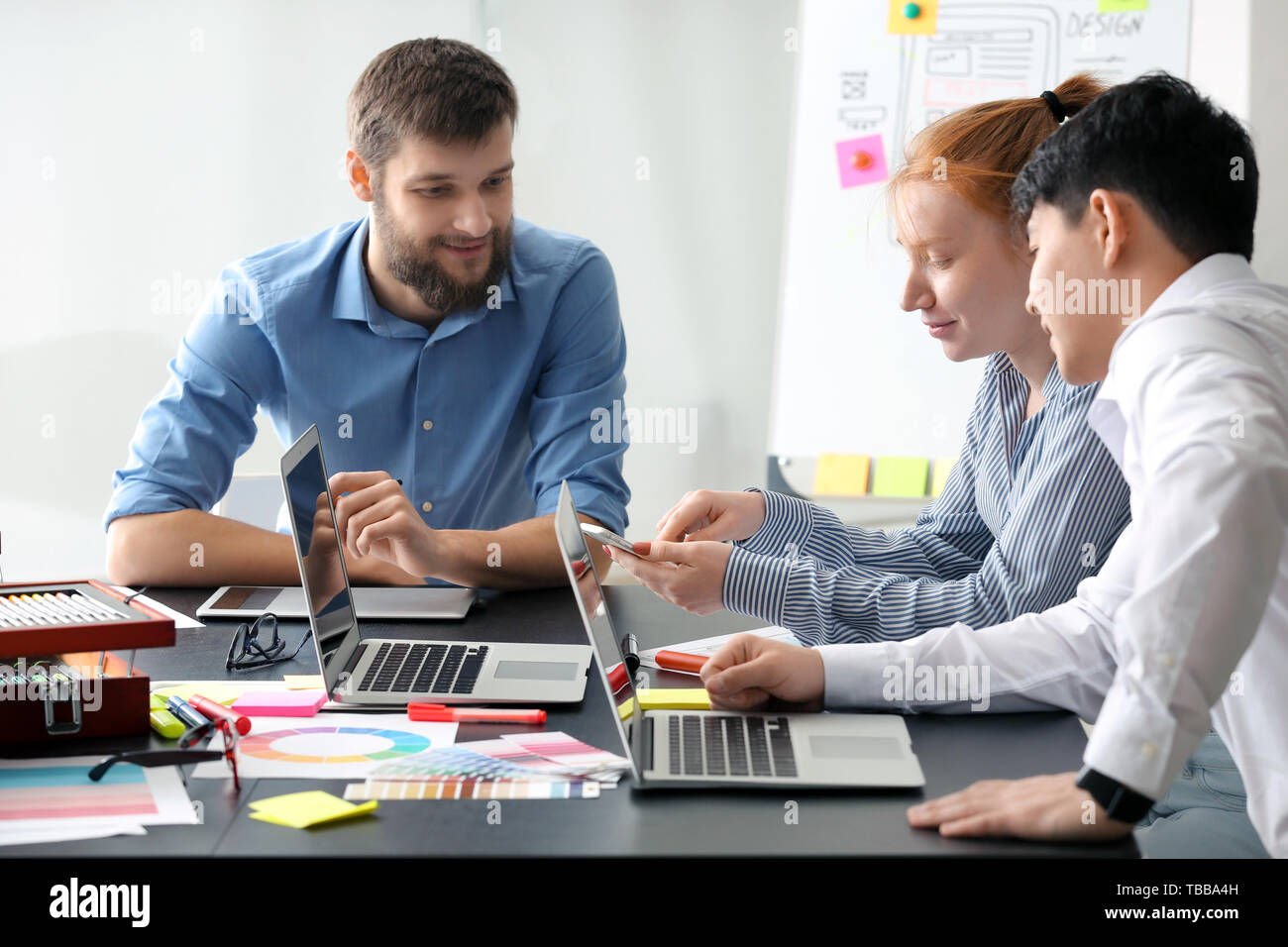Young IT designers working in office Stock Photo